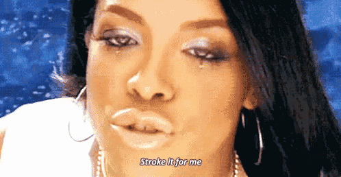 a close up of a woman 's face with a tear on her eye and the words `` stroke it for me '' .