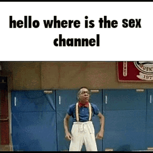 a man in a blue shirt and suspenders is standing in front of a blue wall with the words hello where is the sex channel