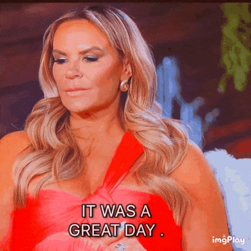 a woman says it was a great day in a red dress