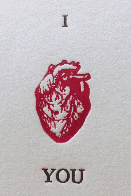 a greeting card with a red heart and the words " i love you "