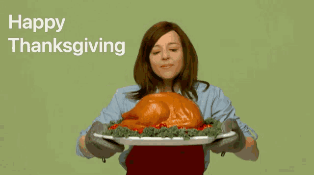 a woman is holding a plate with a turkey on it and the words happy thanksgiving are above her
