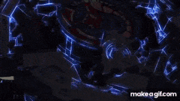 a computer generated image of a blue glowing object on a black background