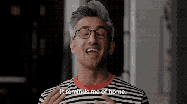 a man in a striped shirt says it reminds me of home