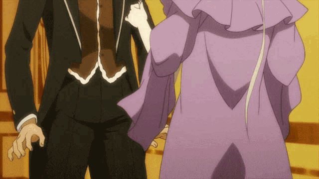 a man in a tuxedo and a woman in a purple dress are dancing together