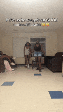 two women are dancing in a living room with a caption that says " pov us bc we got our ghoe concert tickets "