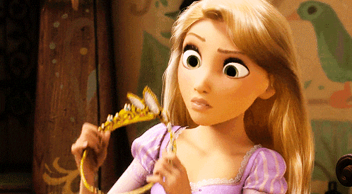 a cartoon girl is holding a tiara in her hand