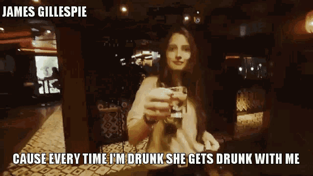 a woman is holding a shot glass with a caption that says james gillespie