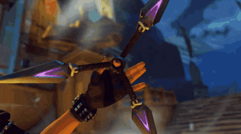 a close up of a person holding a sword with purple tips