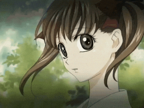 a girl with brown hair and a red bow in her hair