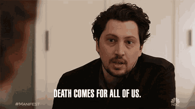 a man says death comes for all of us while looking at a woman