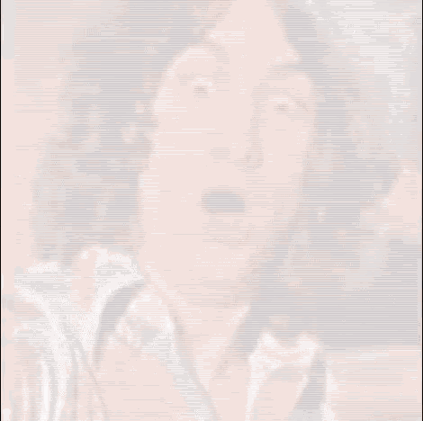 a close up of a man 's face with his mouth open