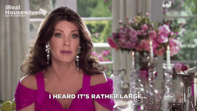 a woman says i heard it 's rather large in front of a table