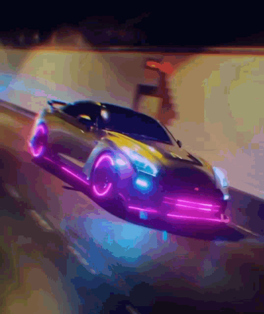 a car with neon lights on the front is driving down a street