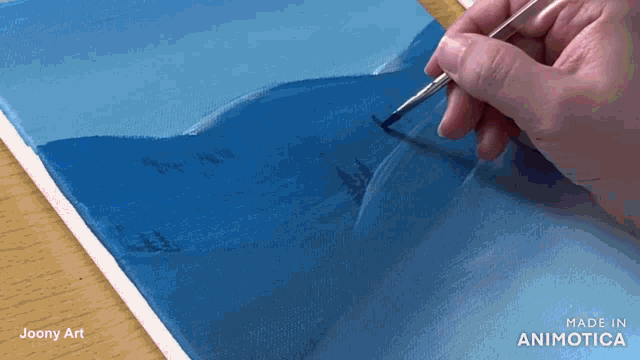 a person is painting a blue sky with a brush and the words made in animotica are visible