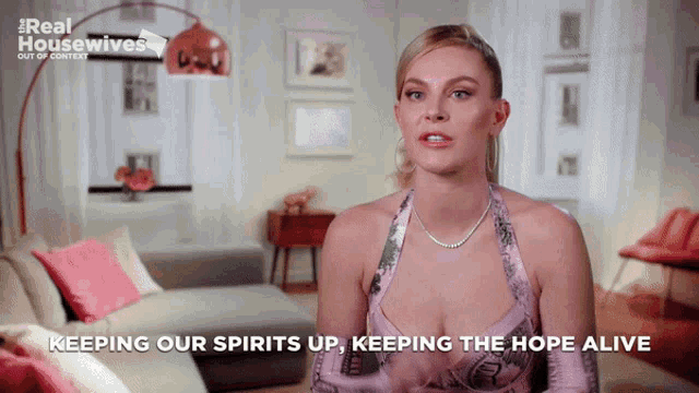 a woman says keeping our spirits up keeping the hope alive in a living room