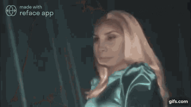 a close up of a woman 's face with blonde hair and a green shirt .
