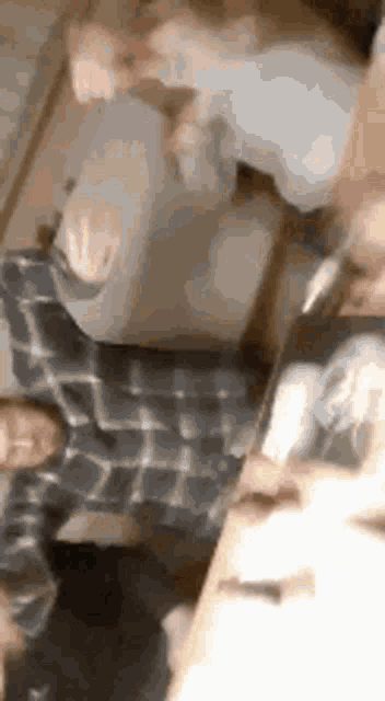 a group of people are standing next to each other on a couch .
