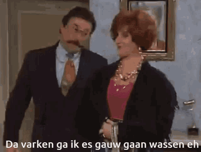 a man and a woman are standing next to each other with the words da varken ga ik es gauw gaan wassen