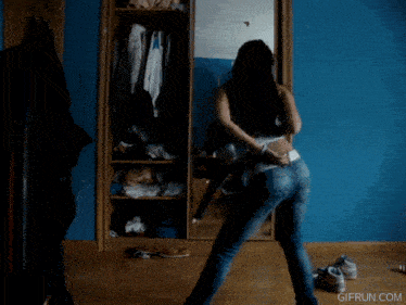 a woman squatting down in front of a mirror with gifrun.com written on the bottom