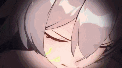 a close up of a girl 's face with her eyes closed in a dark room .