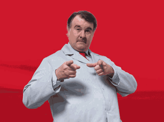 a man in a lab coat giving a thumbs up with a sign that says love it