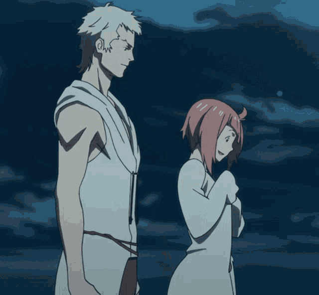 a man and a woman stand next to each other