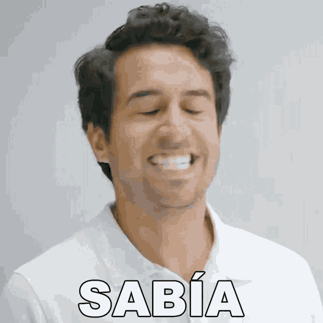 a man in a white shirt is making a funny face and the word sabia is on the front of his shirt