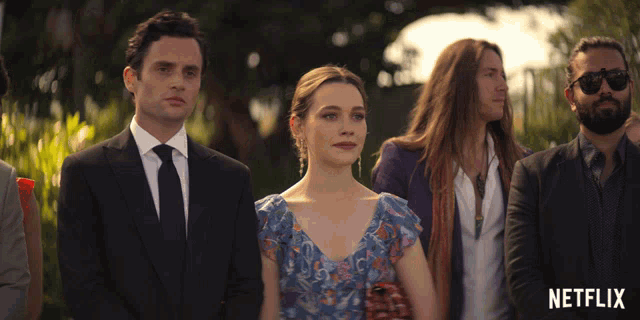 a group of people standing next to each other with a netflix logo in the corner