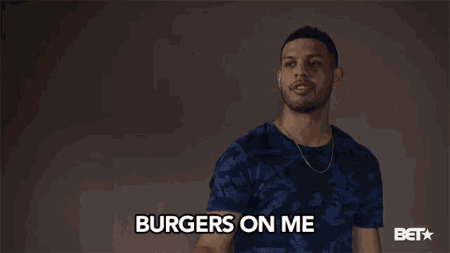 a man says " burgers on me " in a bet ad
