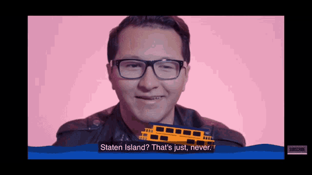 a man with glasses is smiling and holding a boat in front of his face with the words " staten island " on the bottom