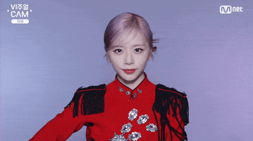 a woman in a red and black outfit with cam written on the bottom right