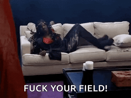a woman is laying on a couch with the words fuck your field written on the bottom