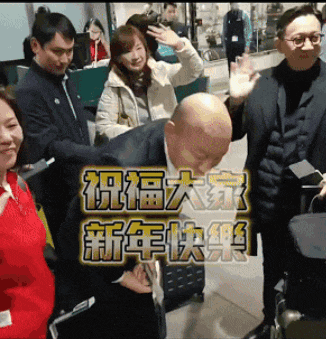 a group of people are standing in front of a sign that says ' chinese ' on it
