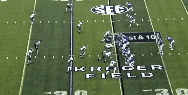 a football game is being played on a field that has the number 20 on it