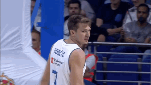 a basketball player wearing a jersey with the name doniccic on the back