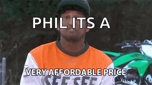 a man says phil its a very affordable price in front of a green motorcycle