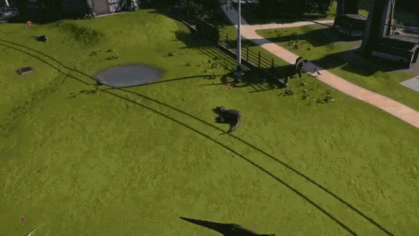 two dinosaurs are fighting on a sidewalk with their shadows cast on the ground