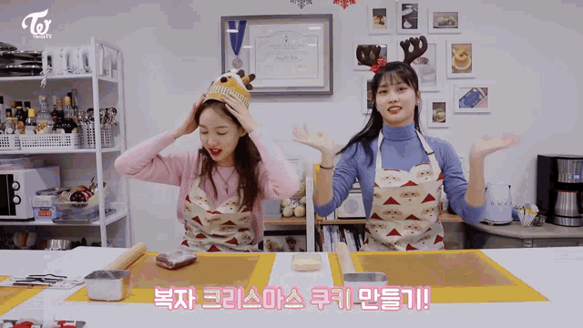 two girls wearing aprons are standing in a kitchen with a sign that says twice