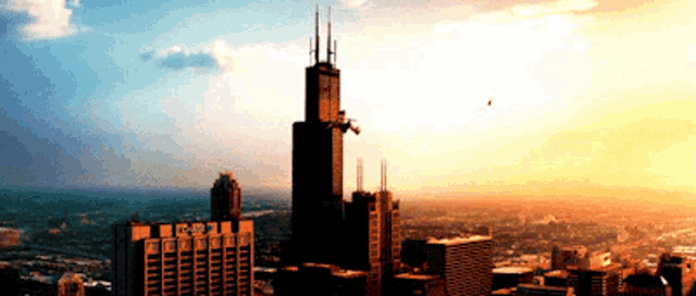 a city skyline with a very tall building in the middle