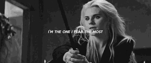 a black and white photo of a woman with the words `` i 'm the one i fear the most '' above her .