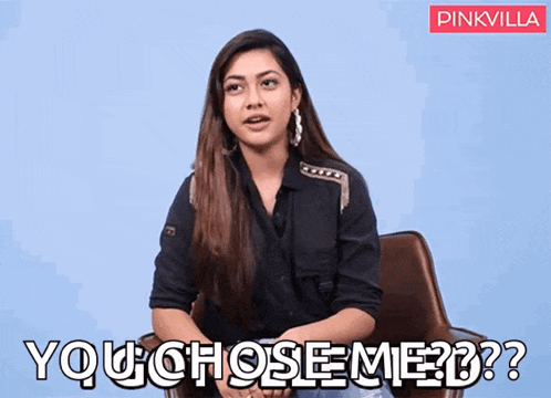 a woman is sitting in a chair and says you chose me ??