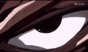 a close up of a person 's eye with a white pupil and a red background .