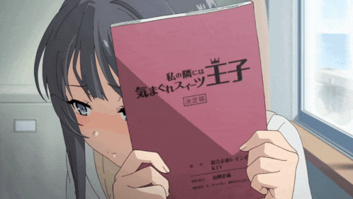 a girl is reading a book with chinese writing