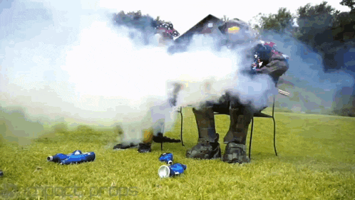 a robot is standing in a field with smoke coming out of its mouth