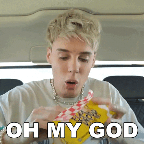a man eating a hot dog with the words oh my god written below him