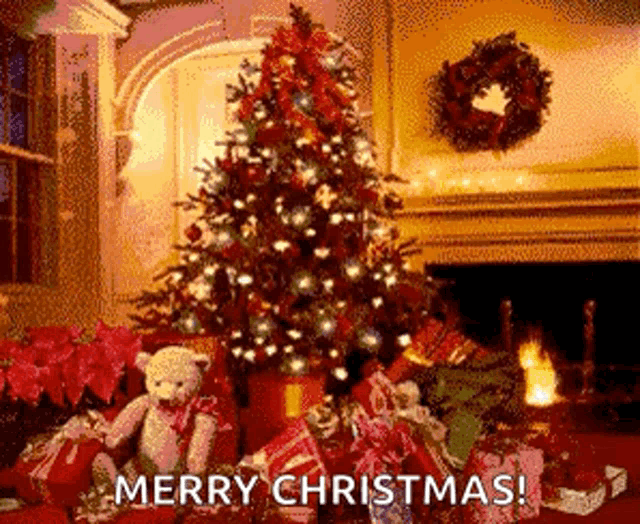 a christmas tree is sitting in front of a fireplace with gifts underneath it and a teddy bear .