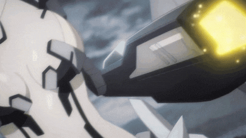 a close up of a robot with a yellow light on