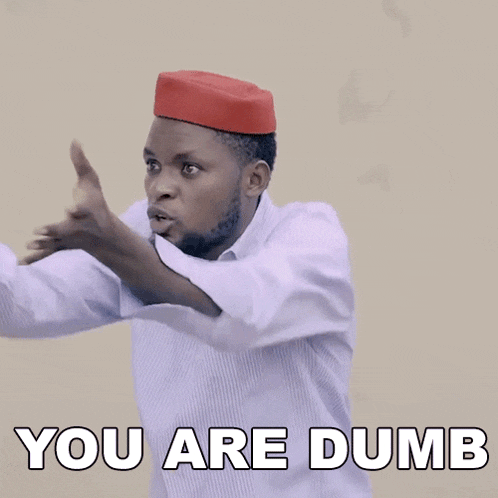 a man wearing a red hat with the words you are dumb written below him