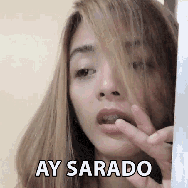 a close up of a woman 's face with the words ay sarado written on the bottom