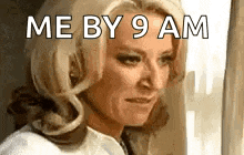 a woman is looking out a window with the words `` me by 9 am '' on her face .